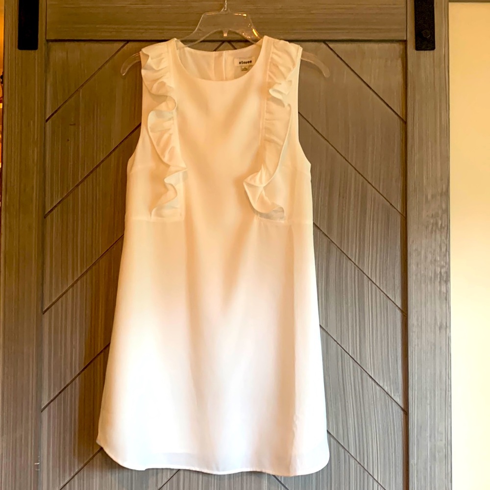 New with tags ivory colored ruffle dress size small.